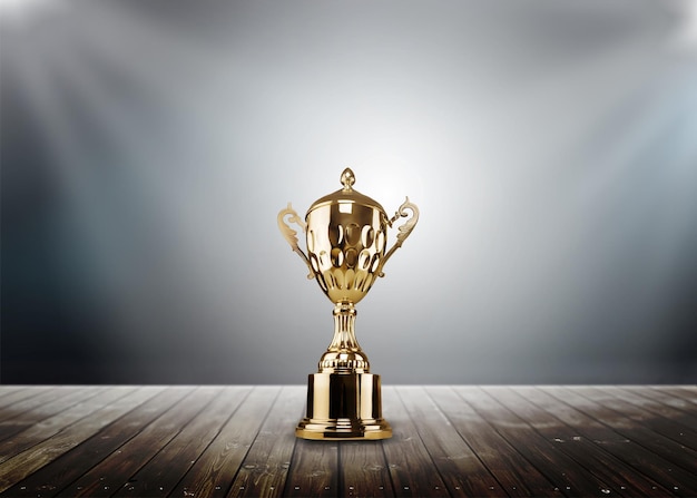 champion golden trophy placed on wooden table