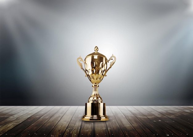 Champion golden trophy placed on wooden table