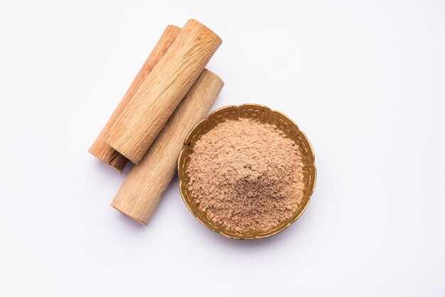 Chandan or sandalwood powder with sticks perfume or oil which retain their fragrance for decades