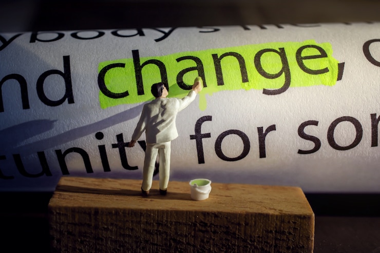 Photo change and challenge concept. present by miniature figure painting green color on text