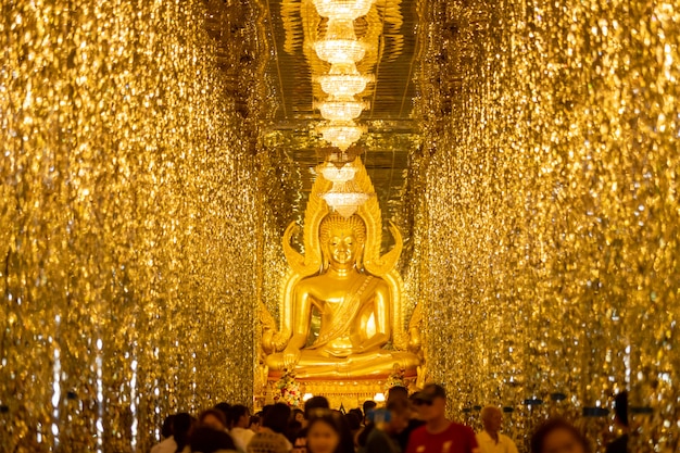 Chantaram Temple or Tha Sung Temple, Beautiful Golden Buddha statue inside Wihan Kaeo or glass sanctuary, Famous place in UTHAI THANI, THAILAND.