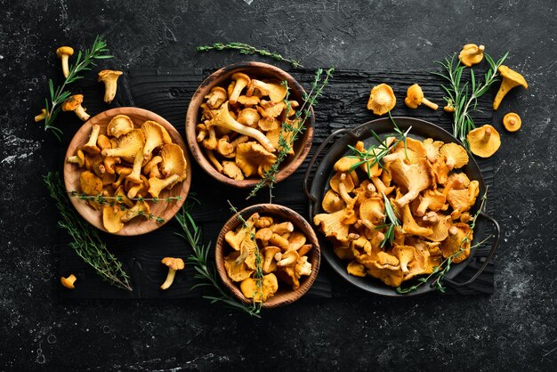 Chanterelle mushrooms are ready to cook in a bowl Top view Free space for text