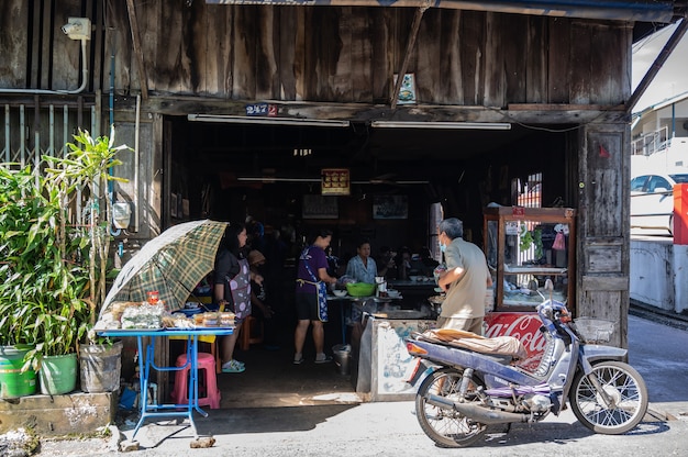 Chanthaburi,thailand-28 nov 2020:Unacquainted tourist walking on The Old Town Chanthaboon Waterfront.Chanthaboon is the ancient waterfront community located on the west side of Chanthaburi River