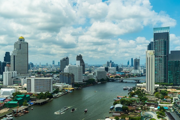 Chao Phraya River with Taksin bridge and building of Bangkok city Thailand