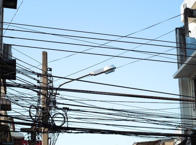 The chaos of cables and wires on every street in city