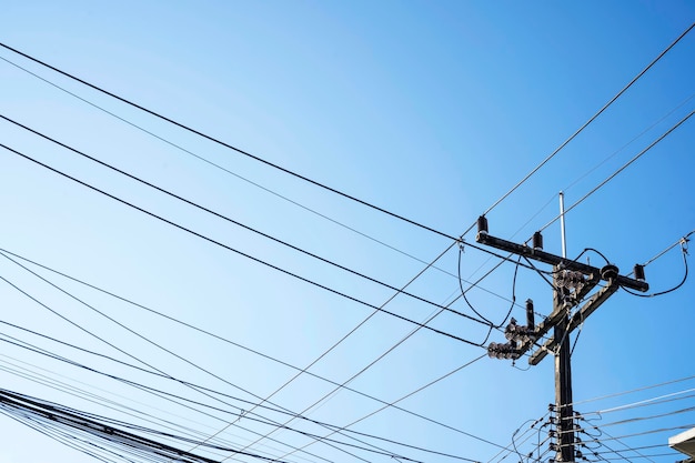 Chaos of electrical cables and wires in Thailand electrification pole with wires mess