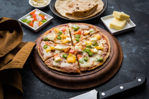 Chapati Pizza made using leftover Roti, Paratha with Cheese, vegetables, paneer and Sausage