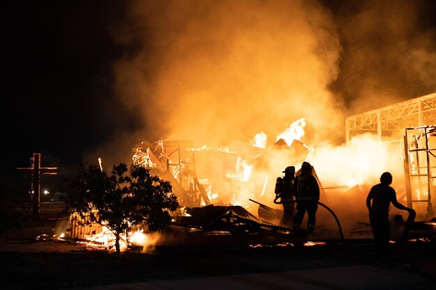 Photo chapel on fire with cross of fire