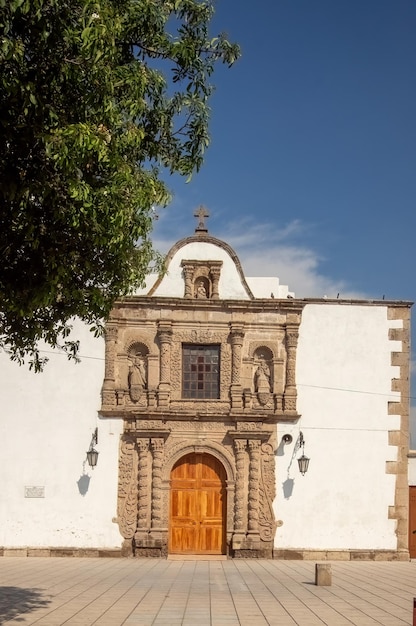 Chapel old building village church colonial architecture walls\
aged wooden door