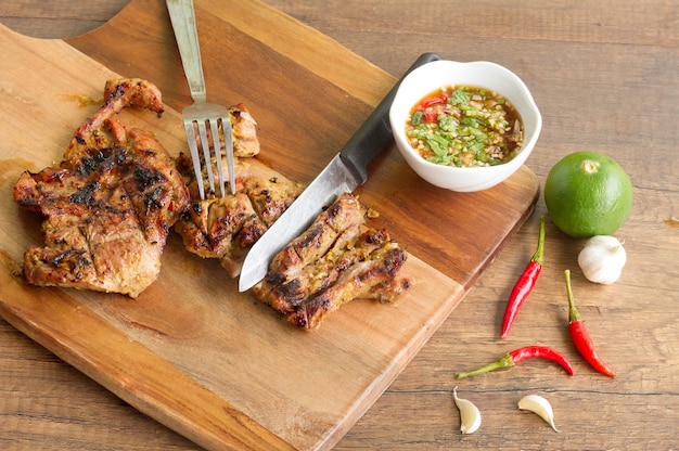 Charcoal-boiled pork neck On the wood table