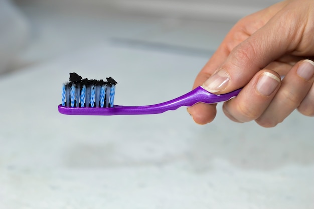 Charcoal on the toothbrush. 