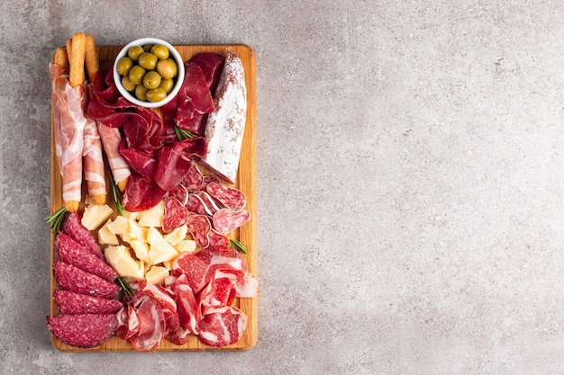 Charcuterie board Antipasti appetizers of meat and cheese platter with salami prosciutto crudo or