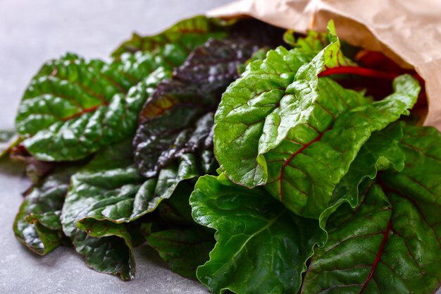 Chard Swiss  Fresh  green and red colored in a paper bag.