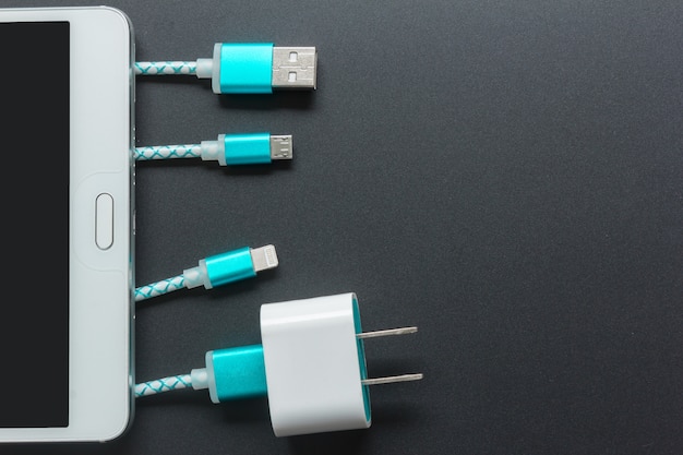 Charging cables for smartphone in top view