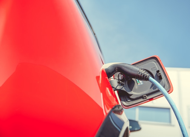 Charging an ecological car with an electric motor at the charging station