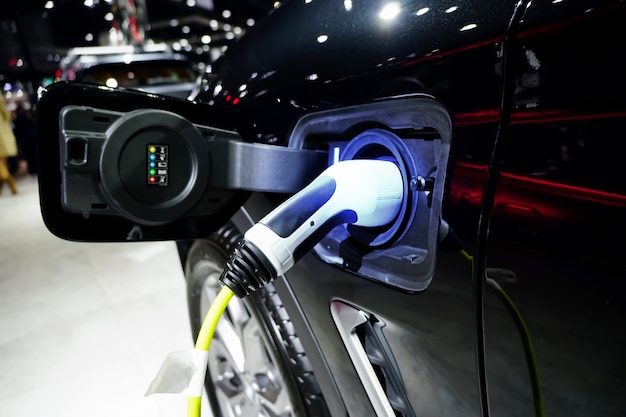 Charging an electric carEV Car or Electric car at charging station Future of transportation