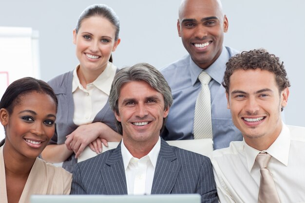 Charismatic International business people using a laptop 