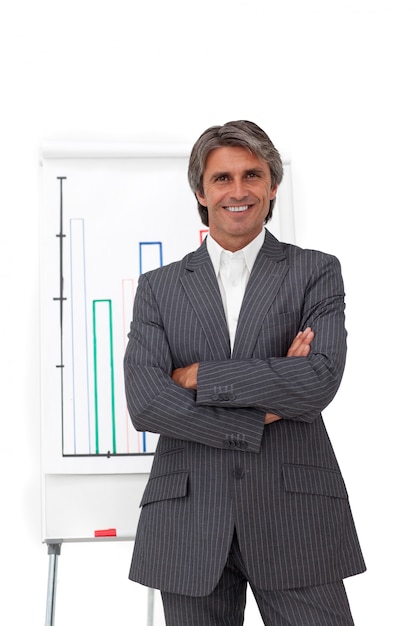 Charismatic mature businessman with folded arms 