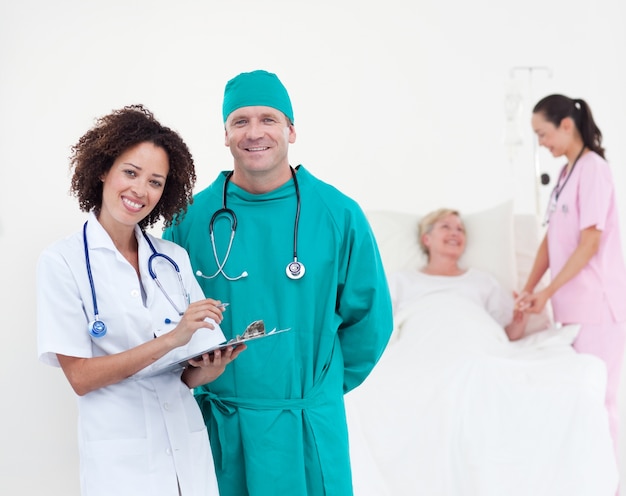 Charismatic team of doctors smiling at camera 