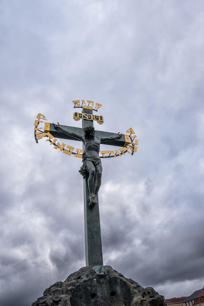 Charles bridge. Prague. Statue of crucified Christ on the bridge.