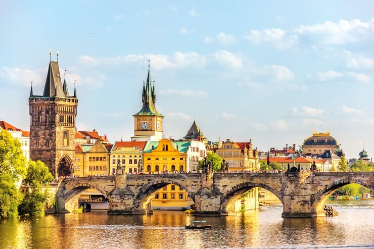 Photo charles bridge prague towers and the national theatre summer d