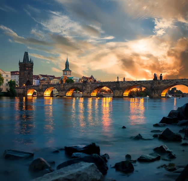 Charles bridge on river Vltava in Prague at dusk