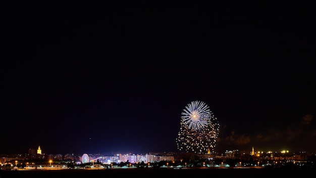 Photo the charm of sevillian night fair and fireworks on the horizon