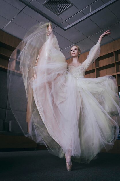 a charming ballerina went to the library to choose a new book during a break