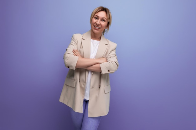 Charming blond young business woman in a jacket