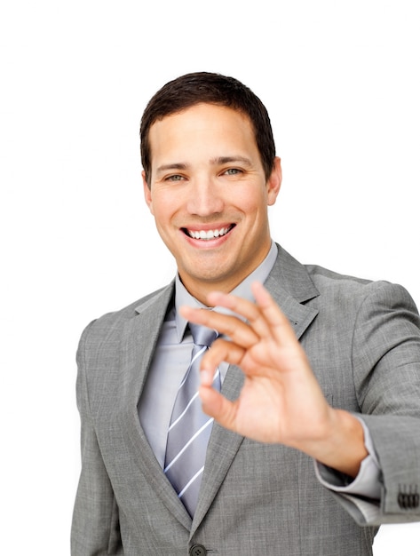 Charming businessman showing OK sign 