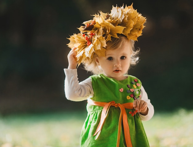 The charming girl has a wreath