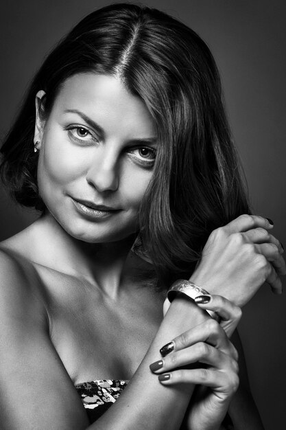 a charming girl reflects on the meaning of life and poses in a photo studio