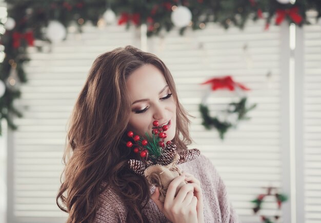 Charming girl with make-up in a sweater in a new year image