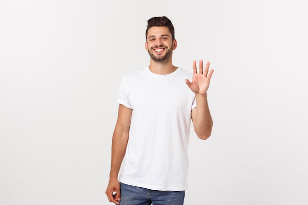 Charming handsome Handsome young man in casual wear while standing isolated