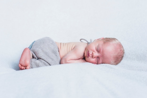 Charming innocent baby on soft muslin