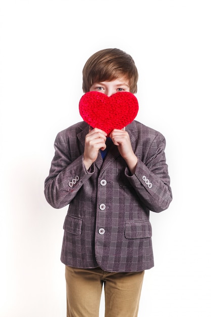 Charming kid posing with heart