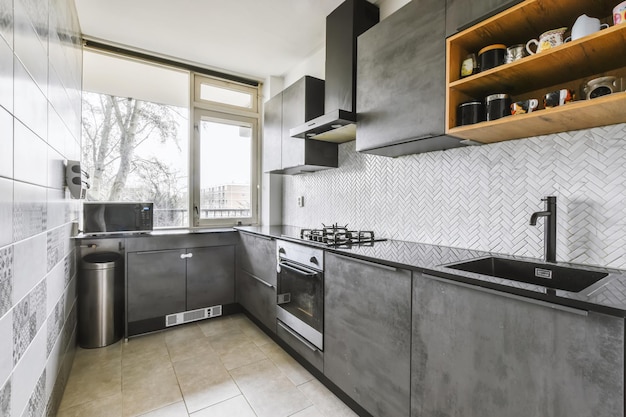 Charming kitchen area with a black kitchen set