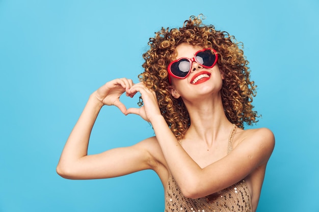 Charming model dancing cropped view red sunglasses and love