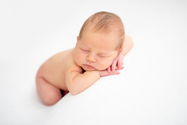 Charming naked newborn