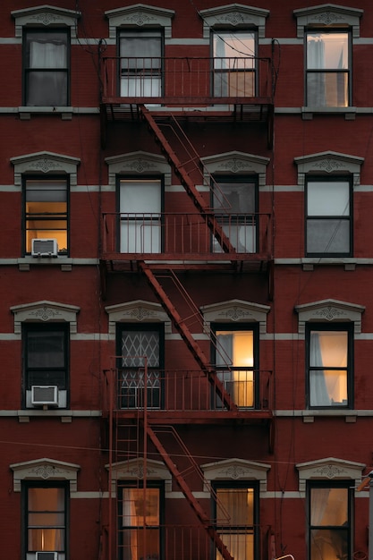 Charming new york architecture with fire escapes and lit windows