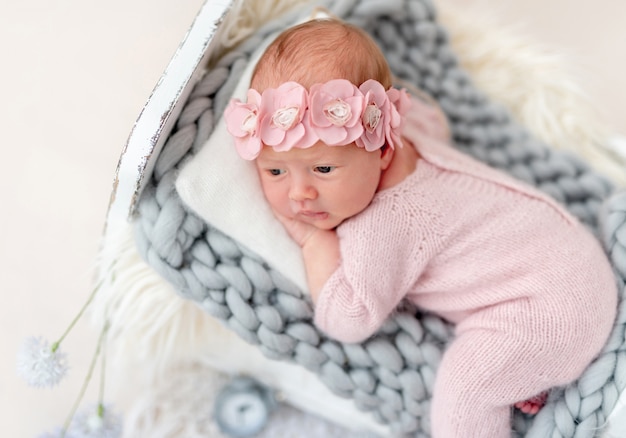 Charming newborn in diadem