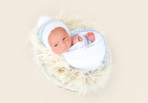 Charming newborn lying awake