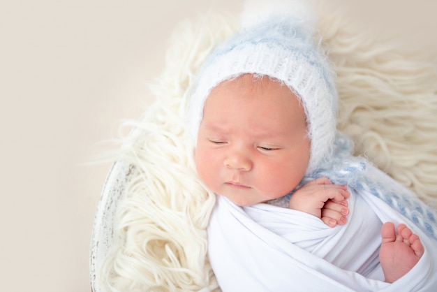 Charming newborn lying awake