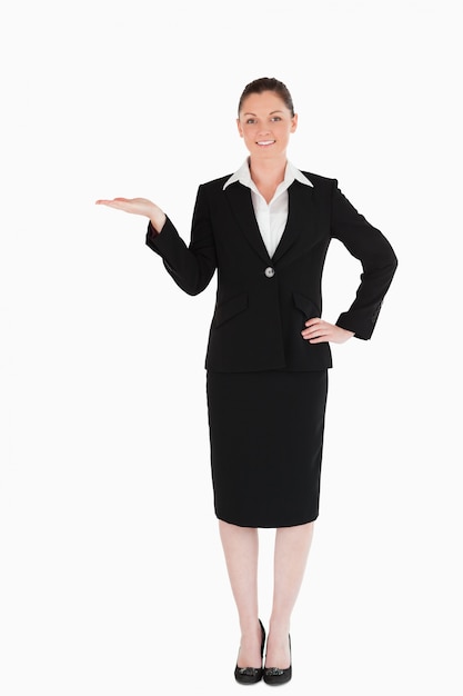 Charming woman in suit showing a copy space