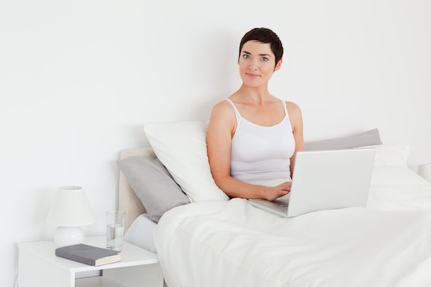 Charming woman using a laptop