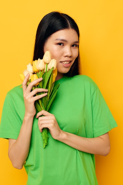 Charming young Asian woman bouquet of flowers romance spring posing isolated background unaltered