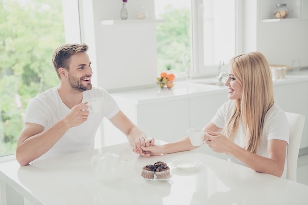 Charming young couple posing together indoors