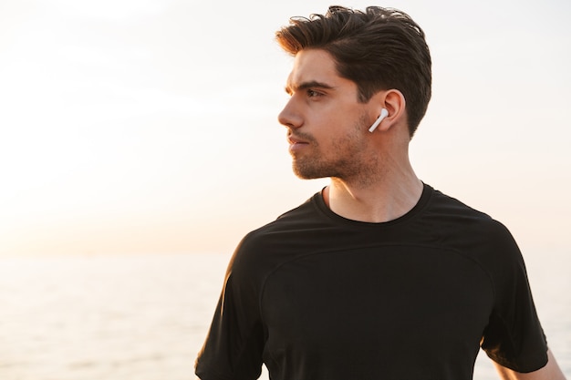 Charming young sportsman in black shirt