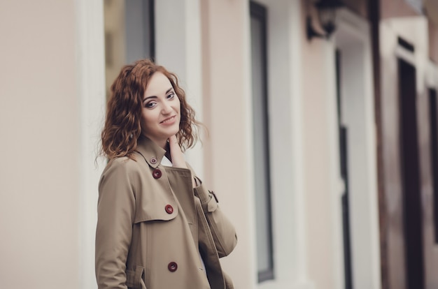 Charming young woman smiling in a jacket