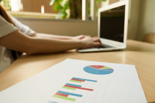 Chart with laptop on table